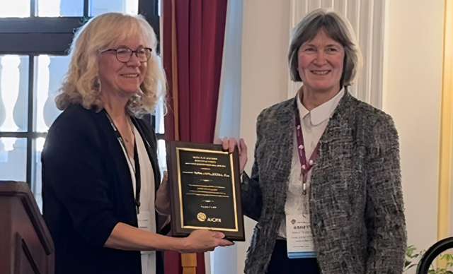 dixon-award-2-640x388 Photo of Annette Nellen receiving the Horn Distinguished Service Award from Cheri H. Freeh.